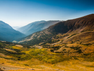 A valley around the tundra area at Rocky Mountain National Park in the morning sun.