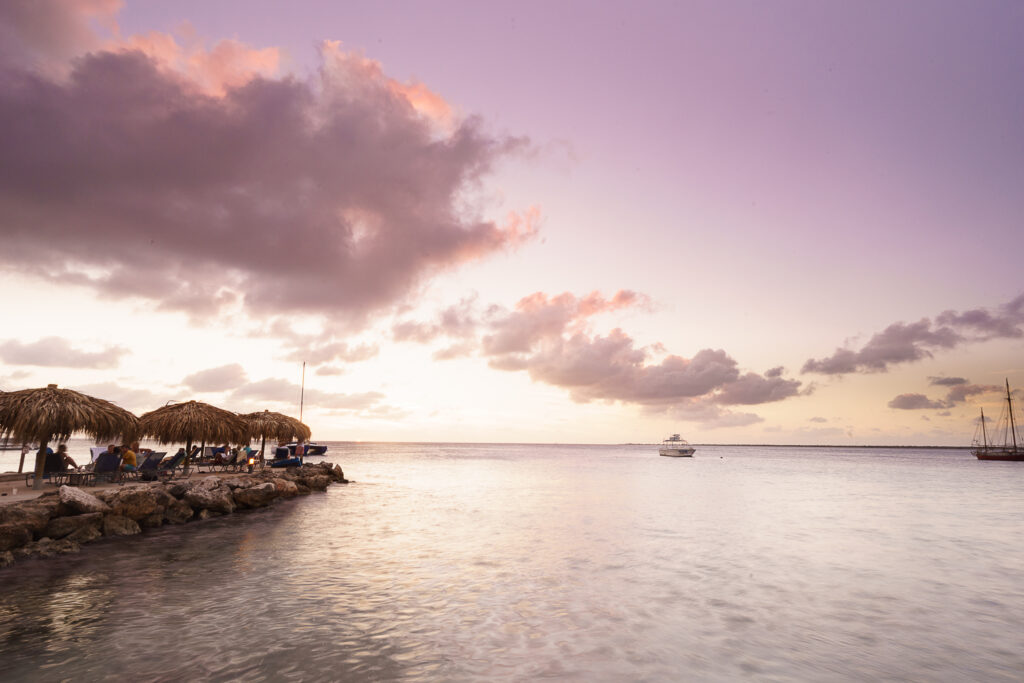 Tourists enjoy the sunset in Kralendijk, Bonaire. Bonaire is one of the most popular destinationgs for scuba diving lovers.