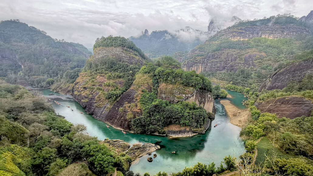 The Nine-Bend River runs through the Wuyi Mountain range at Wuyishan National Park, China.