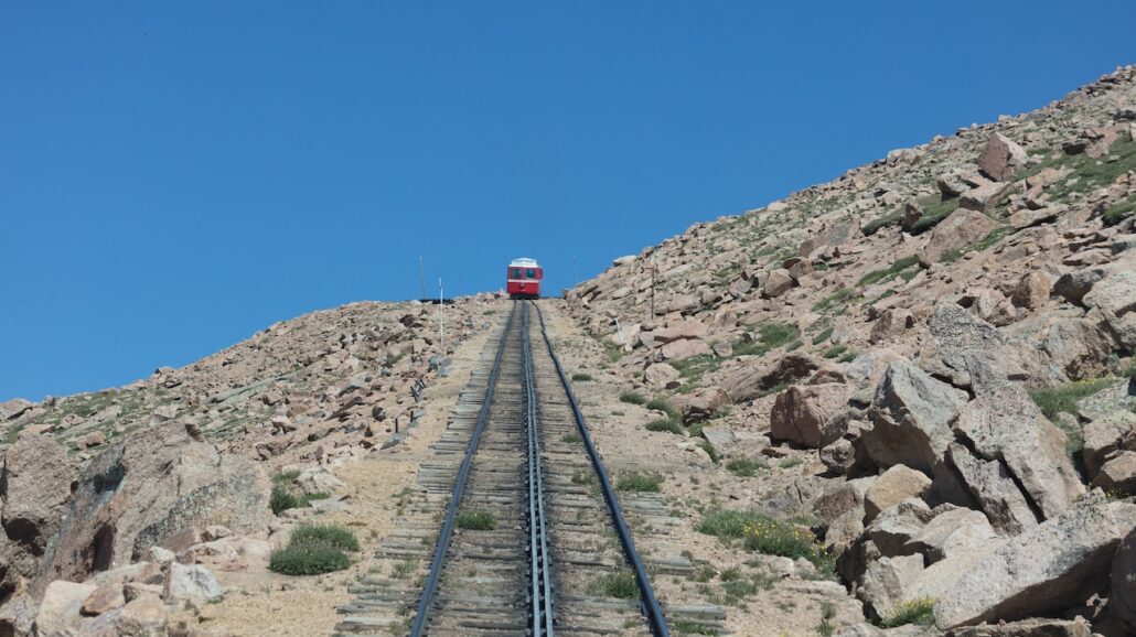 A cog railroad takes tourists to the summit of Pikes Peak.