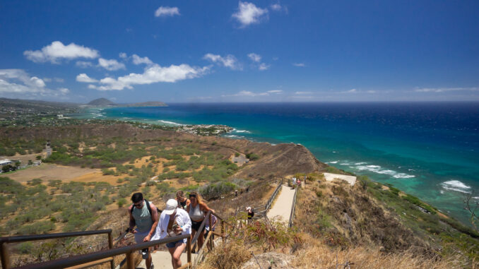 Tourists work their way to the summit of Diamond Head on Oahu.