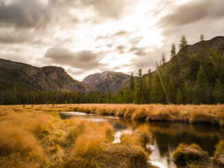 Mt. Craig was seen under the fast moving clouds at the East Meadow in Rocky Mountain National Park in Colorado on a windy autumn day.